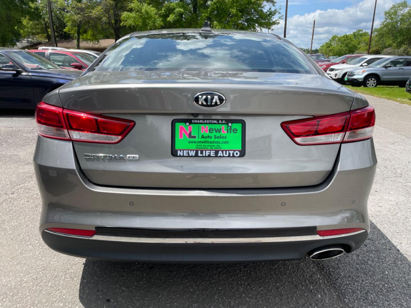 2018 GRAY KIA OPTIMA LX (5XXGT4L34JG) with an 2.4L engine, Automatic transmission, located at 5103 Dorchester Rd., Charleston, SC, 29418-5607, (843) 767-1122, 36.245171, -115.228050 - Roomy Interior with AUX/USB/Sat/Bluetooth, Power Windows, Power Locks, Power Mirrors, Backup Camera, Keyless Entry, Alloy Wheels. 118k miles Located at New Life Auto Sales! 2023 WINNER for Post & Courier's Charleston's Choice Pre-owned Car Dealer AND 2018-2024 Top 5 Finalist for Charleston City Pap - Photo#5